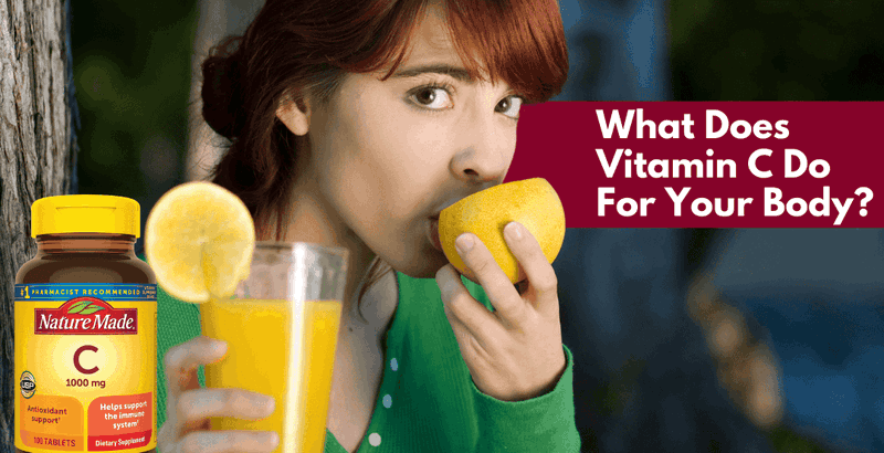 A young woman holding a glass of orange juice while eating from half an orange.