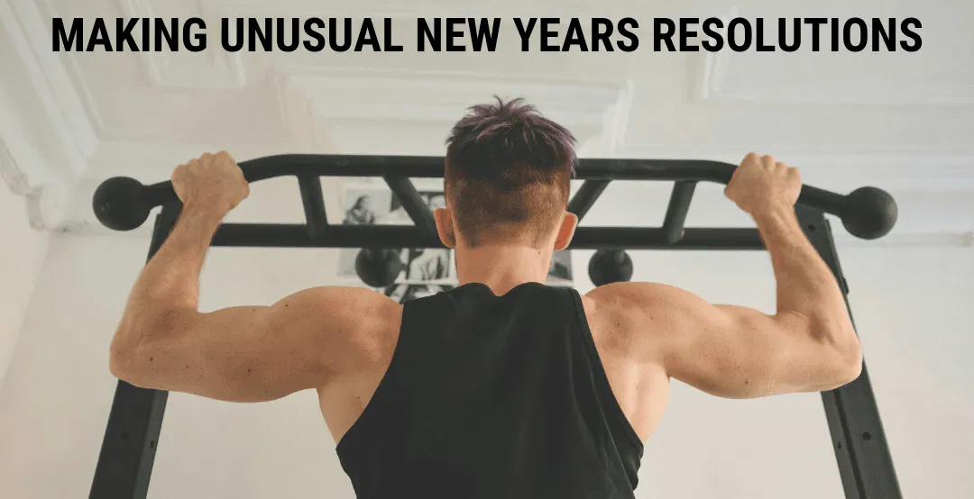 A man doing pull-ups on a bar at home. 