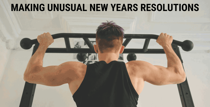 A man doing pull-ups on a bar at home. 