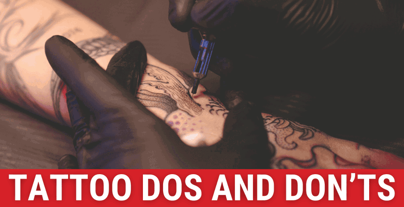 A tattoo artist using their needle to apply ink to person's arm