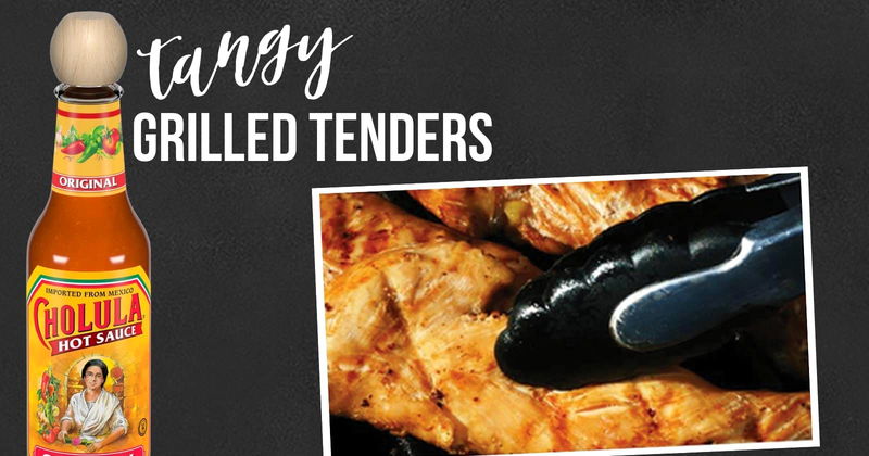 Grilled chicken tenders with tongs