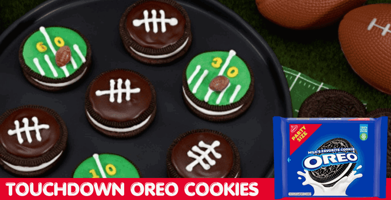 Football-themed decorated OREOs on a black plate with a whistle and mini football on the table next to the plate